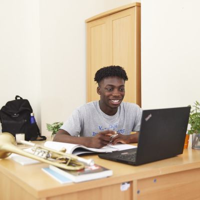 A boy sat at a desk
